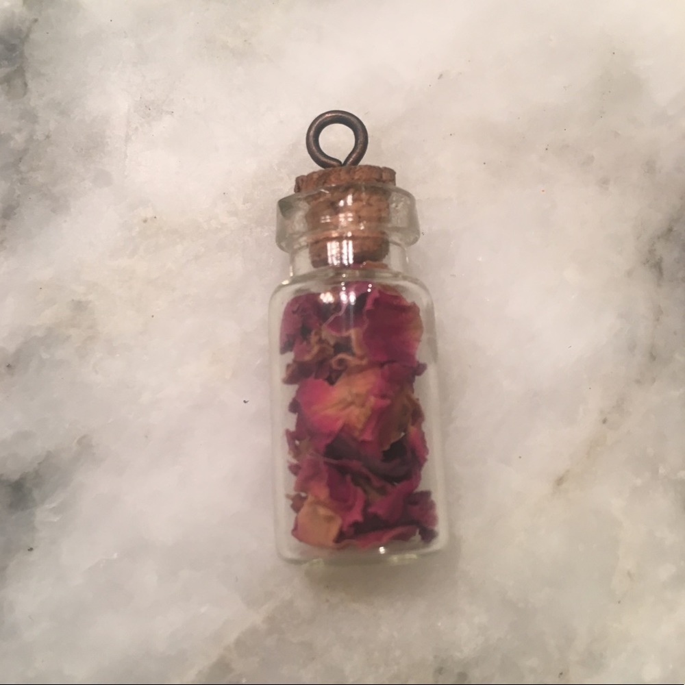 Bottle of rose petals necklace